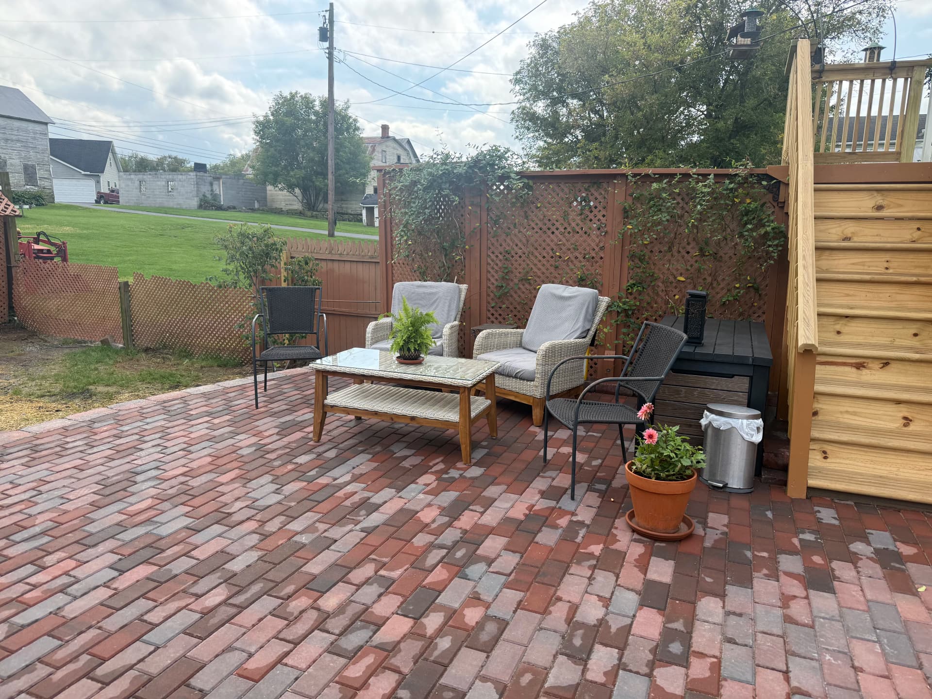 Paver Patio With Retaining Wall and Fresh Planting Beds