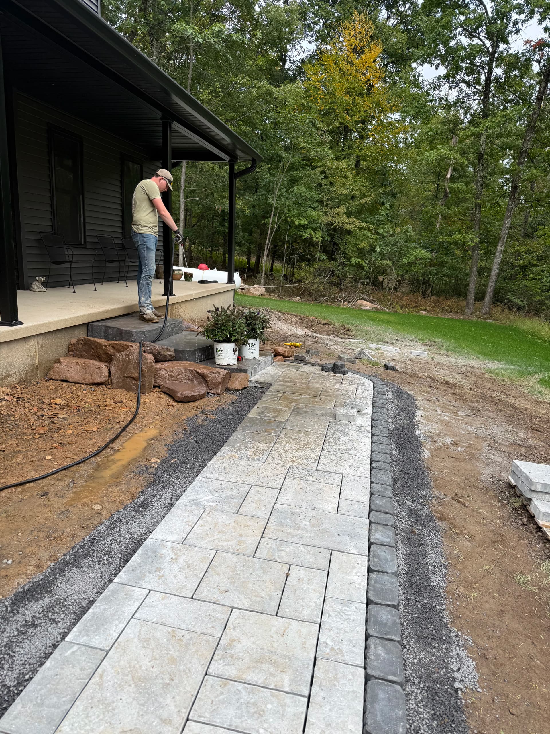 Paver Walkway Installation in Progress With Planting Layout
