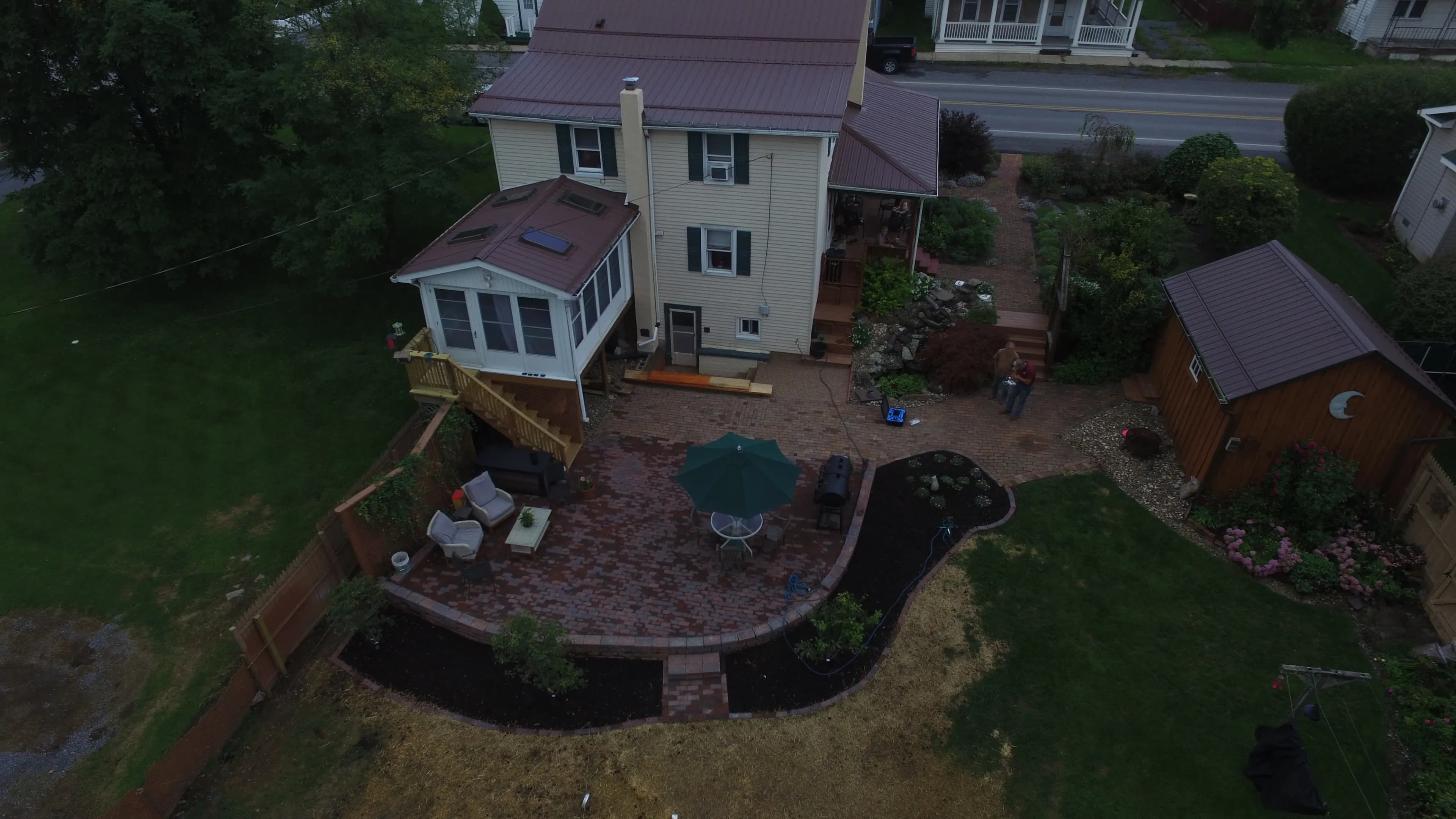 Project Paver Patio With Retaining Wall and Fresh Planting Beds image