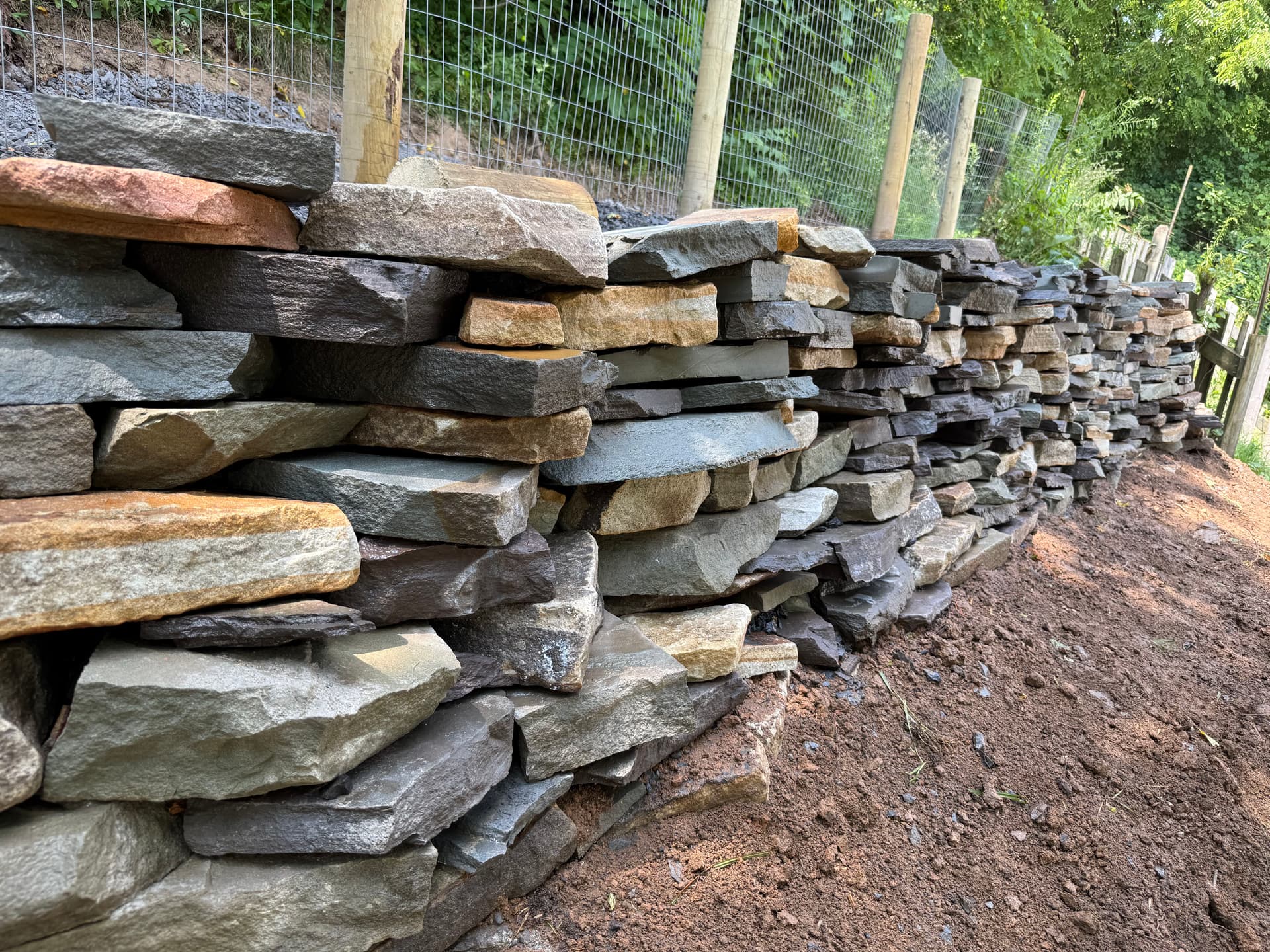 Gallery photos for Natural Stone Retaining Wall Built to Hold and Drain Right: Image #4