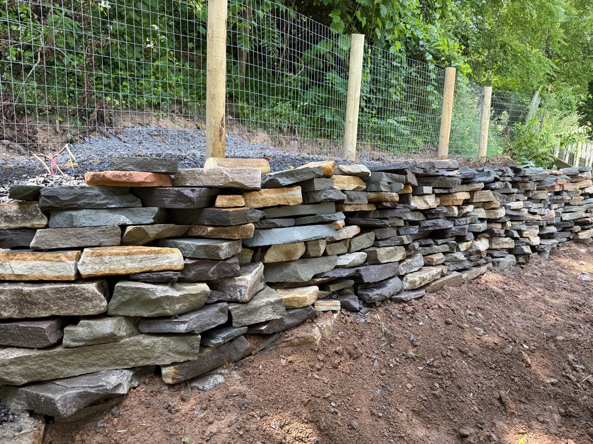 Gallery photos for Natural Stone Retaining Wall Built to Hold and Drain Right: Image #3