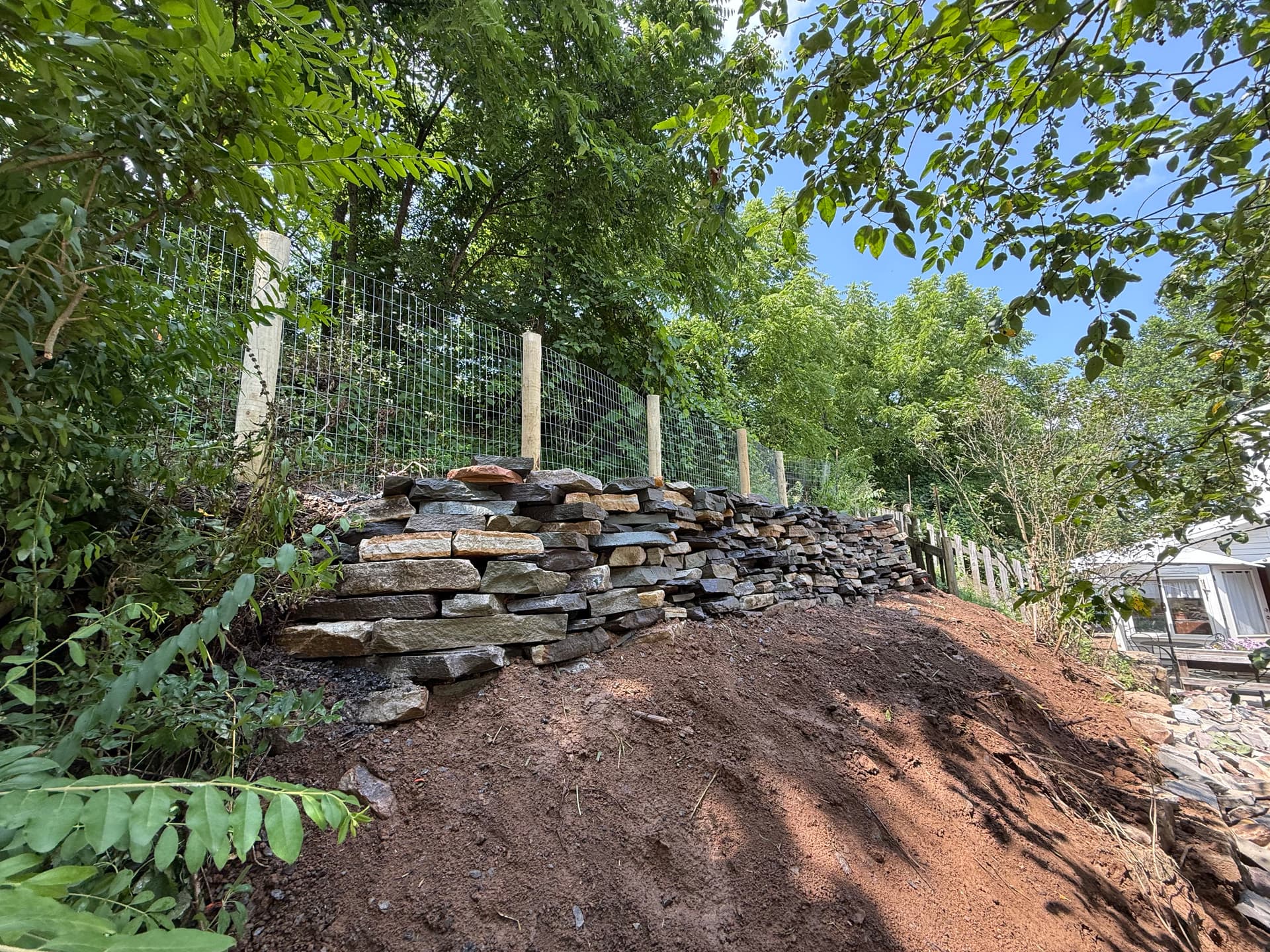 Gallery photos for Natural Stone Retaining Wall Built to Hold and Drain Right: Image #1