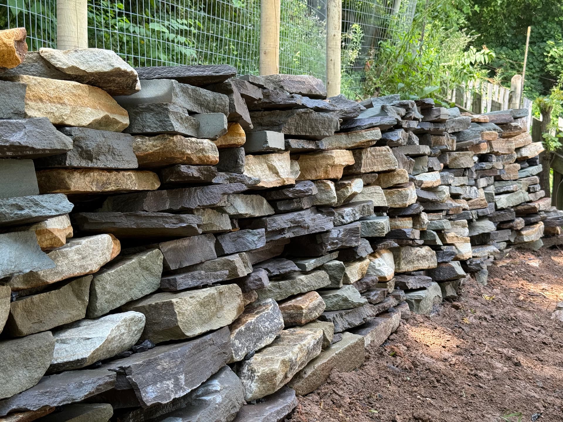 Gallery photos for Natural Stone Retaining Wall Built to Hold and Drain Right: Image #5